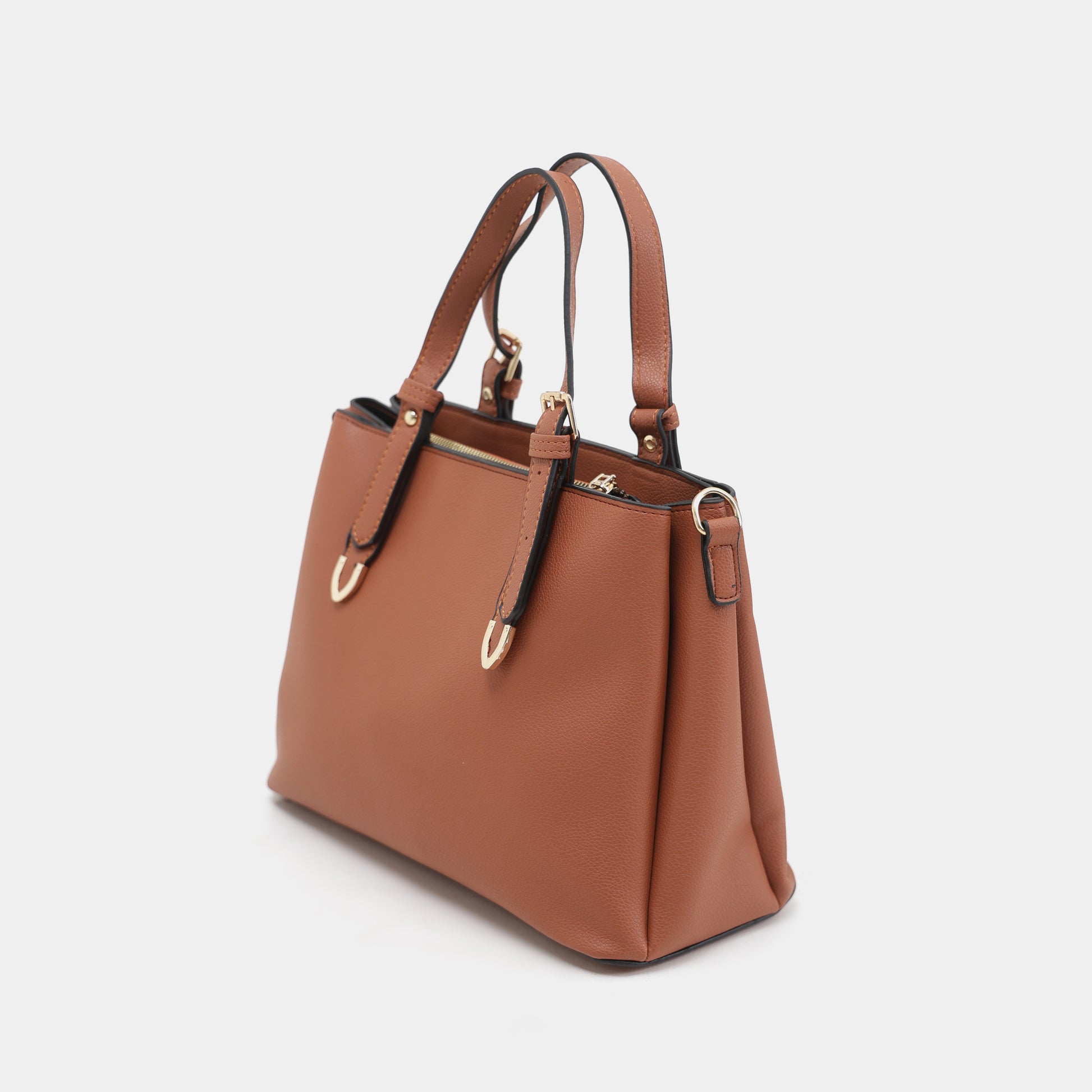 Brown handbag with gold hardware on a light gray background